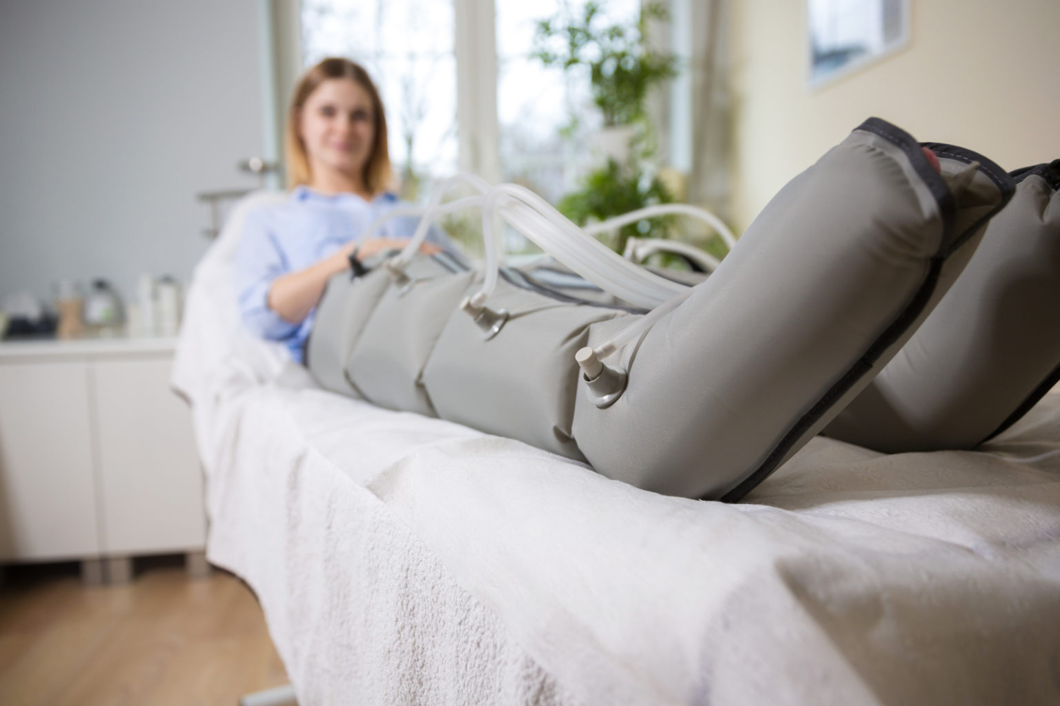 Woman at beautician's during firming hypotensive massage